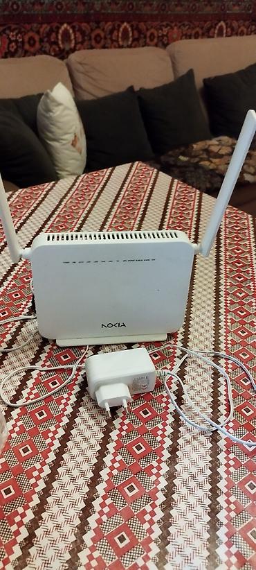 wifi modem nokia: Nokia Wi‑Fi router - Model: Nokia (ağ rəngli), iki ədəd xarici antena — 1