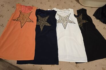 Qadın şalvarları: Bu dəstə müxtəlif üslublu dörd qadın şalvarı və bir qara ətək — 48