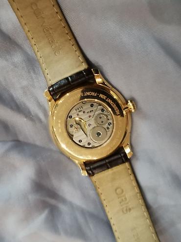 золотой часы: Oris 396-7580-60-51LS — швейцарские механические золотые наручные — 2