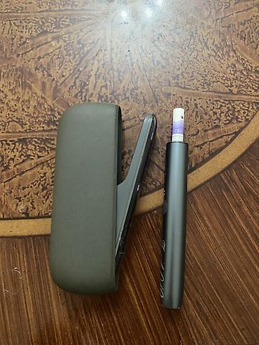 stringer alt geyimi: IQOS elektron tütün qızdırıcı cihazı Məhsulun tərkibi: - IQOS — 1