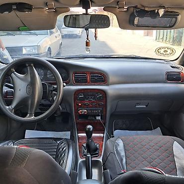 Kia: Kia Clarus: 2 l | 1997 il Sedan — 14