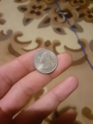 50 dollar: ABŞ kwartır dolları (25 sent) sikkəsi - Ön üzündə: George Washington — 1