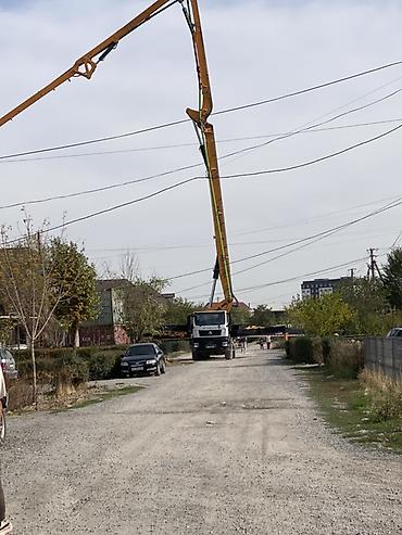 пистолет по бетону: Автобетононасос с длинной распределительной стрелой Услуги по подаче — 1