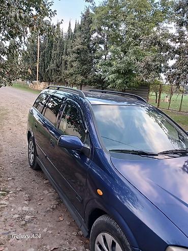 Продажа авто: Opel Astra Caravan (universal), mavi rəng. - Kuzov: universal, dam — 4