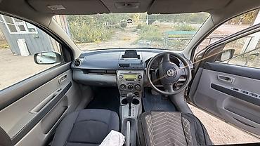 мотоцикл полуавтомат: Mazda Demio: 2004 г., 1.3 л, Автомат, Бензин, Хэтчбэк — 1