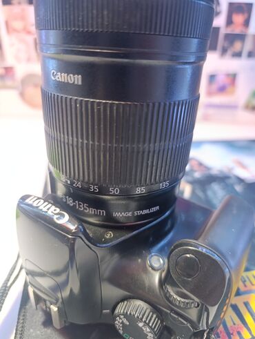 Фотоаппараты: Цифровая зеркальная камера Canon EOS 1100D с универсальным