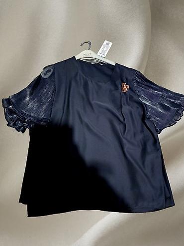 differente obuca: Elegantna ženska bluza u crnoj boji.
Veća serija — 1