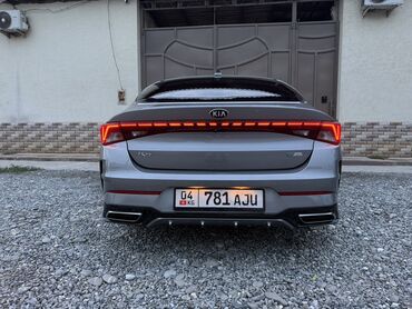 киа селтос бишкек: Автомобиль Kia K5 серого цвета с оригинальным дизайном задней части