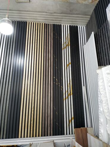 divar ucun dekor: Divar panelləri müxtəlif rəng və naxışlarda təklif olunur. Bu panellər