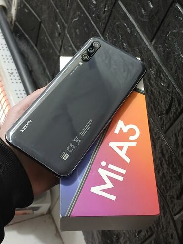 Xiaomi: Xiaomi Mi A3, 128 GB, rəng - Gümüşü, 
 Zəmanət, Sensor, Simsiz şarj