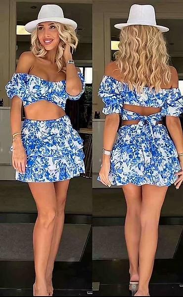 kiko: Dvodijelni ženski set – top i mini suknja s volanima
3300 din
S M L — 2