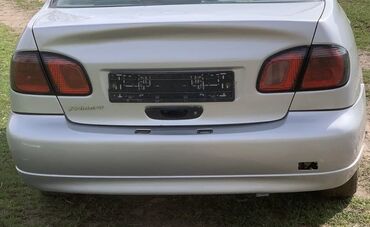 авто замок на машину: Багажниктин капкагынын илмектери Nissan, 2001 г., Колдонулган, Оригинал