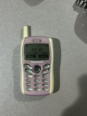 klaviatura qiymetleri: Panasonic klassik mobil telefon - Rəng: açıq çəhrayı/bənövşəyi ön