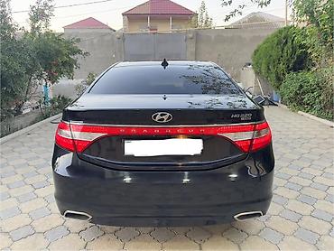 mitsubishi lancer evolution: Hyundai Grandeur: 2.2 l | 2015 il Sedan — 6