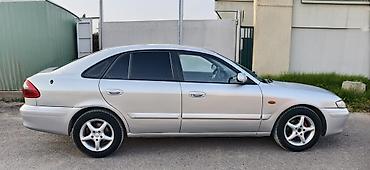 чехол на мопед: Mazda 626: 2000 г., 2 л, Механика, Бензин, Хэтчбэк — 4