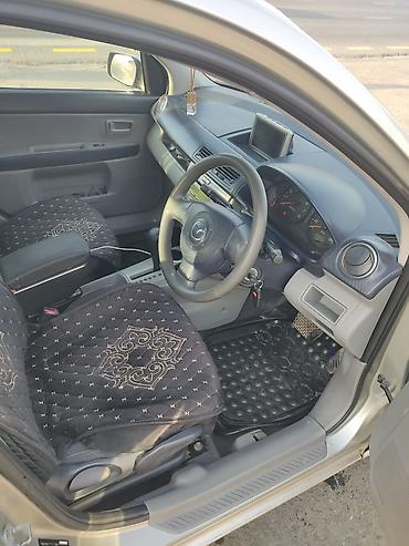 митсубиши спейс стар: Mazda Demio: 2004 г., Автомат, Бензин — 8