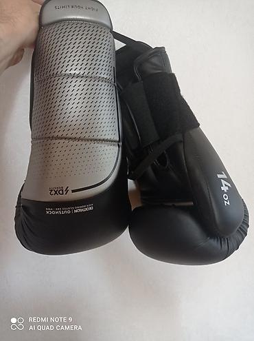 Boks əlcəkləri – 14 oz - Rəng: qara/gümüş - Üst hissə: perforasiyalı lalafo.az -da Boks əlcəkləri – 14 oz - Rəng: qara/gümüş - Üst hissə: perforasiyalı