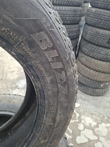 Шины: Bridgestone Blizzak DM‑V2 — комплект зимних шин без шипов. - Размер — 4