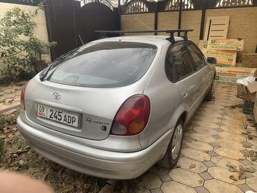 на опель вектра а: Серебристый хэтчбек Toyota Corolla с багажником на крыше. Автомобиль