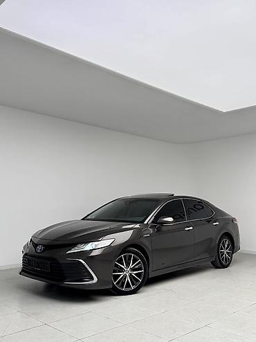 tayota progres: Toyota Camry: 2022 г., 2.5 л, Автомат, Гибрид, Седан — 1