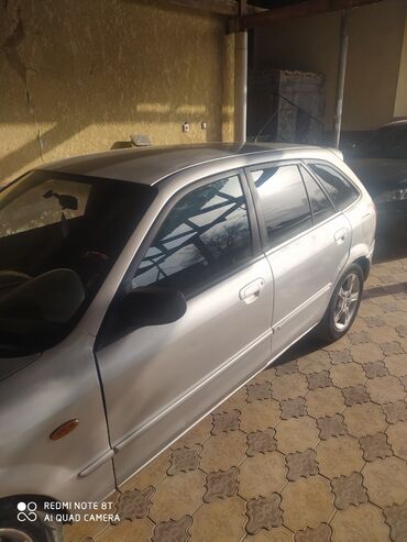 Mazda: Mazda 323: 2003 г., 1.6 л, Механика, Хэтчбэк — 1