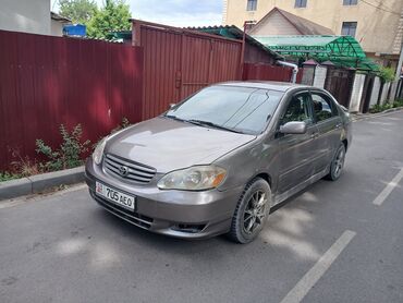 taeta: Продается седан Toyota Corolla серого цвета. Этот автомобиль