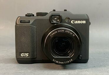 фотоаппарат для подводной съемки: Canon PowerShot G15. Фотоаппарат черного цвета с 5-кратным зумом