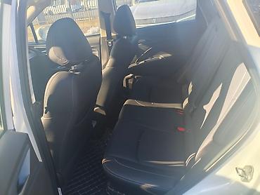 Другие автомобили: NETA V — компактный пятидверный электрический кроссовер в белом цвете — 8