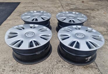 Gume i felne: Komplet od 4 čelične felne sa originalnim Opel ratkapama. - na lalafo.rs — 3 Gume i felne: Komplet od 4 čelične felne sa originalnim Opel ratkapama. - — 3