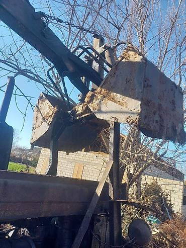 Ekskavatorlar: Ekskavator-yükleyici (traktor bazalı) – ön bıçaq və arxa ekskavator — 4