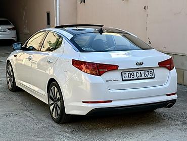 Kia: Kia Optima – ağ rəngli sedan Xarici xüsusiyyətlər: - Şık ağ kuzov — 7