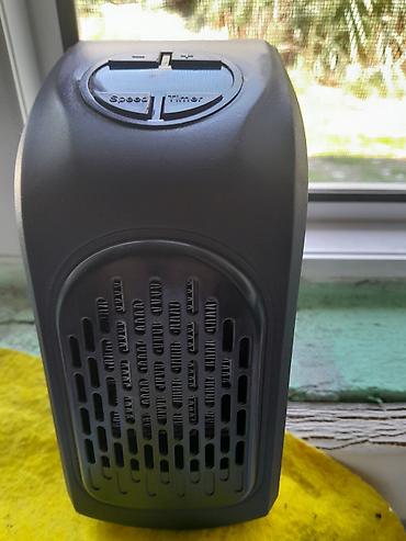 Elektrikli qızdırıcılar və radiatorlar: İki məişət cihazı bir yerdə: 1) Mini elektrikli isidici (Handy Heater — 2