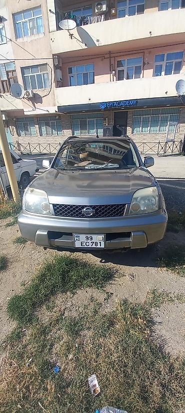 forut satsi: Nissan X-Trail: 2 l | 2002 il Krossover — 1