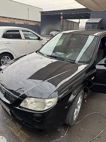 maxda demio: Mazda 323: 2001 г., Механика, Бензин, Хэтчбэк — 4