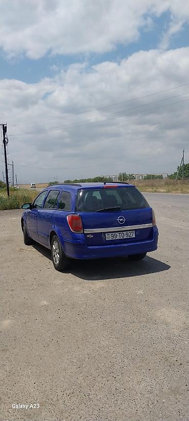 Opel Astra Caravan (universal), mavi rəng. Kuzov: 5 qapılı, geniş lalafo.az -da Opel Astra Caravan (universal), mavi rəng. Kuzov: 5 qapılı, geniş