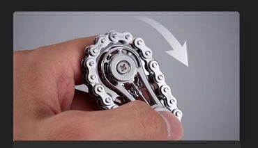 Игрушки: Небольшой спиннер из металла, выполненный в виде велосипедной цепи — 3