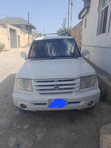 Чехлы: Mitsubishi Pajero Mini: 2 л | 2000 г. 515155 км Внедорожник