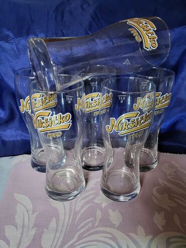 Čaše: Case nove Niksicko pivo. Nove case. sve na njima odsjaj od svetla na lalafo.rs — 1 Čaše: Case nove Niksicko pivo. Nove case. sve na njima odsjaj od svetla — 1