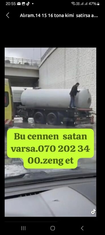 Toxumlar: Şəkildə iri sənaye çəni təsvir edilmişdir. Silindrik formalı, ağ