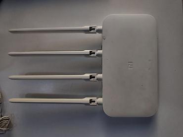 xiaomi pad 6: Dörd antenalı, ağ rəngli Mi Wi-Fi router. Bu cihaz evdə və ya ofisdə — 2