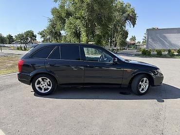 Транспорт: Mazda 323: 2002 г., 1.6 л, Механика, Бензин, Хэтчбэк — 5