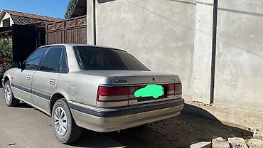 Oldsmobile: Mazda 626: 1990 г., Седан — 2