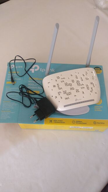 Modemlər və şəbəkə avadanlıqları: TP-Link şirkətindən olan simsiz ADSL2+ modem-router. Evdə və ya ofisdə