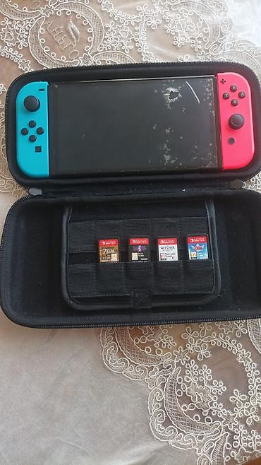 nintendo switch az: Satılır Nintendo Switch konsol set: Nintendo Switch Konsol + 4 Oyun + — 1