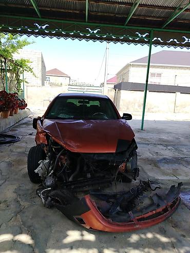 dizel generator qiymetleri: Kia Rio hatchback (CRDI, Sport paket yazıları ilə). Narıncı-qara iki — 4