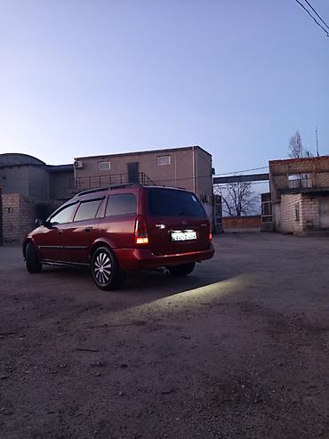 tap az opel vectra: Opel Astra универсал kuzovlu minik avtomobil. Rəngi tünd qırmızı — 5