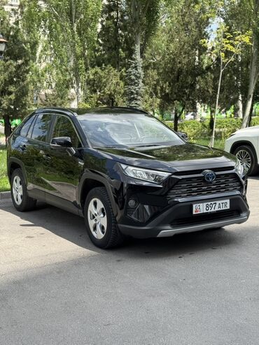 тойота гибрид кроссовер: Черный полноприводный кроссовер Toyota RAV4 Hybrid. Автомобиль