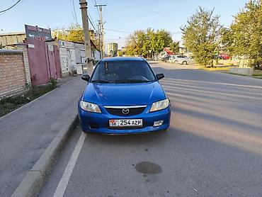 шина ош: Mazda Familia: 2002 г., 1.6 л, Кол менен иштөөчү, Бензин, Универсал — 1