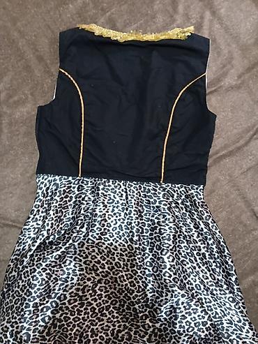 Haljine: Haljina s leopard printom i korset vezivanjem - Model: midi haljina — 8