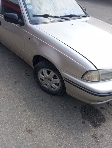 Daewoo: Model: Daewoo Nexia sedan Kuzov: 4 qapılı, gümüşü rəng — 5